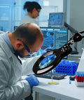 Scientist using Bifocal Magnifying Desk Lamp With Clamp And Detachable 6 Inch Lens in a lab for detailed examination