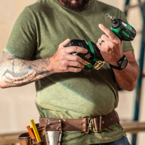 Person holding 18V MultiVolt Cordless Brushless Impact Driver from Combo Kit for Framing and Finishing with Compact Design