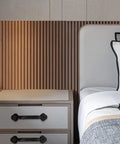Nightstand with Vintage Metal Drawer Pulls Three Piece Set, Rustic Black Alloy Cabinet Handles, next to a bed.