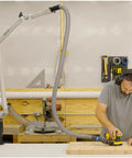 Third Hand Dust Collection Boom Arm for Workbench Mount with On Demand Fume Extraction installed over workbench with man sanding