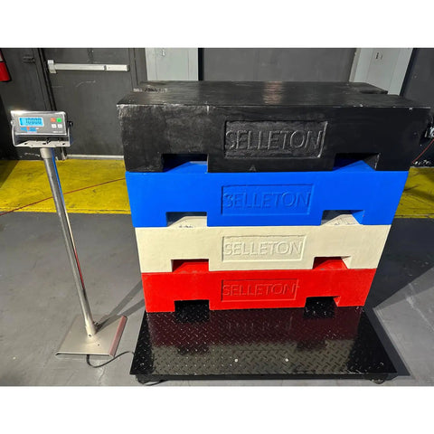Pro Grade 40 By 40 Inch Heavy Duty Industrial Floor Scale Built Tough As Nails With A Rock Solid 5000 Pound Capacity And Dead On One Pound Accuracy For Warehouse Shifts measuring stacked pallets in a warehouse.