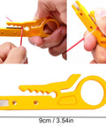Wire stripping tool close-up, user stripping red wire, 9cm yellow device for soldering projects, DIY electronics.