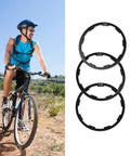 Cyclist riding next to Three Sizes Aluminum Bike Cassette Spacers Kit 1mm 1.5mm 2mm For Freehub Alignment Headset Washer