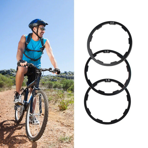 Cyclist riding next to Three Sizes Aluminum Bike Cassette Spacers Kit 1mm 1.5mm 2mm For Freehub Alignment Headset Washer