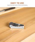 Close-up of Heavy Duty Barn Door Floor Guide With Slick TPE Rubber Caster on wood surface, supporting smooth rolling action.