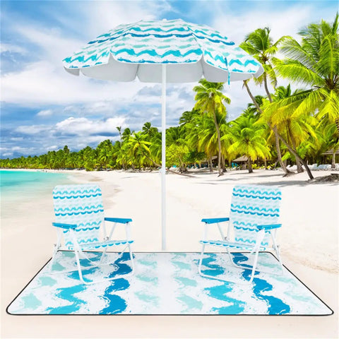Blue Four Piece Beach Set With Sun Proof Umbrella Two Folding Chairs Waterproof Blanket on sandy beach