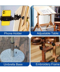 Phone holder for easy device access, adjustable table for drafting, sturdy umbrella base, and embroidery frame setup.