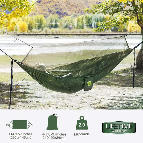 Camping Hammock With Net And Rain Fly Portable Lightweight Outdoor Hammock Tent Kit set up between trees by a river