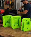 Green wall mounted storage rack set for Milwaukee M18 tools and 18V batteries on workshop table, screws included