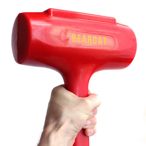 Hand holding a Red Beefy Polyurethane Coated Dead Blow Hammer With Textured Grip For No Bounce And Quiet Taps, 3 And A Quarter Inch Diameter Head