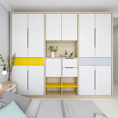 Contemporary bedroom with white cabinets featuring matte white edge cabinet finger pulls, yellow accents, and modern decor.