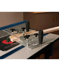 Router Table Coping Sled Kit With Sacrificial Backing Board And Adjustable Fence Guide Spacers in use on a router table