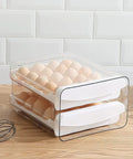 Clear Plastic Egg Holder With Two Layer 40 Egg Capacity Drawer Style Fridge Storage Box For Fresh Eggs visible on countertop
