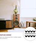 Living room with speaker and table, featuring Black Iron Corner Guards for Cabinets and Speakers, Tough As Nails Heavy Duty Metal Corner Protectors.