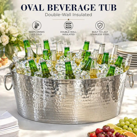 Armored XL Insulated Beverage Tub For Parties, Double Wall Stainless Steel Ice Bucket filled with bottles on a table.