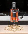 Slick Badass Desktop CNC Router Machine With 500W Spindle And Dual Linear Rails For Precision Wood And Acrylic Carving Projects engraver carving a detailed wooden lion design.