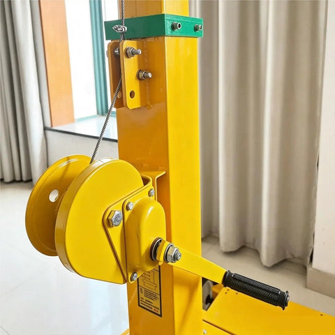 Close-up of Grab And Crank Portable 3 To 9 Meter Manual Telescopic Mast showing pulley and hand crank mechanism in yellow aluminum.
