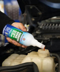 Radiator Stop Leak Treatment For Cars 16 Fl Oz being poured into car radiator coolant reservoir