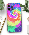 Spiral Tie Dye Full Body Skin Decal Wrap Kit For iPhone 13 with Screen Trim and Back Skin Matte Soft-Touch Finish displayed on desk