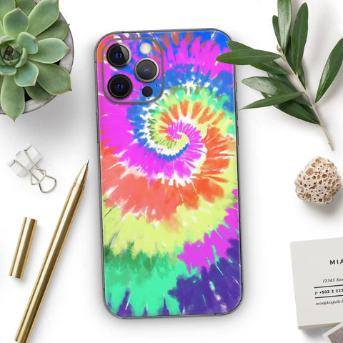 Spiral Tie Dye Full Body Skin Decal Wrap Kit For iPhone 13 with Screen Trim and Back Skin Matte Soft-Touch Finish displayed on desk