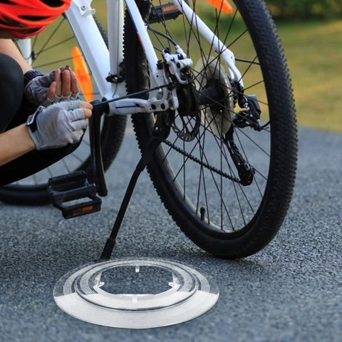 Person installing Chain Guard And Spoke Protector For Mountain And Road Bikes, Dirt Proof Flywheel Shield on rear wheel