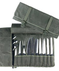 Pro Grade Heavy Duty Waxed Canvas Knife Roll Case for Chefs showing knives and utensils secured in slots, with buckle closure.