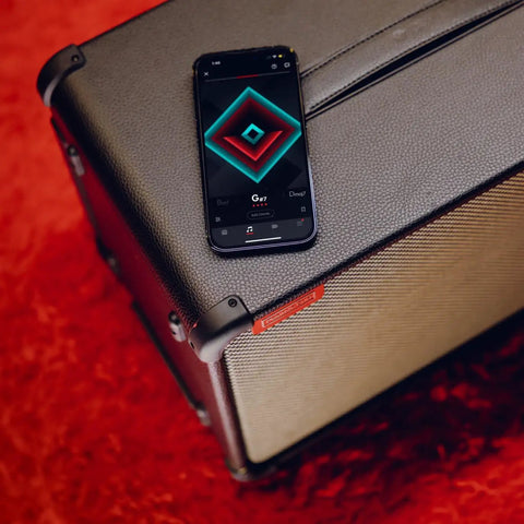 Spark Live Smart Guitar Amp With 4-Channel PA, Built-In Mixing, Effects, App Control, and Bluetooth speaker on red carpet