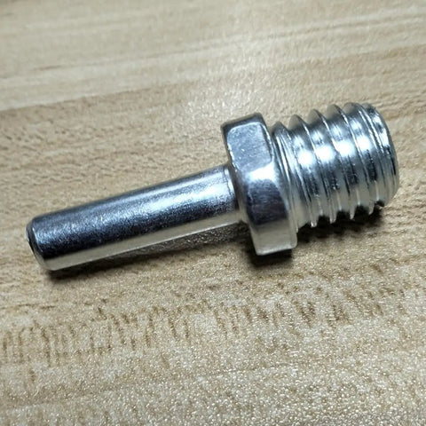 Slick Two Pack 5811 Male Thread To Quarter Inch Round Shank Drill Adapter made of durable steel on wood surface.