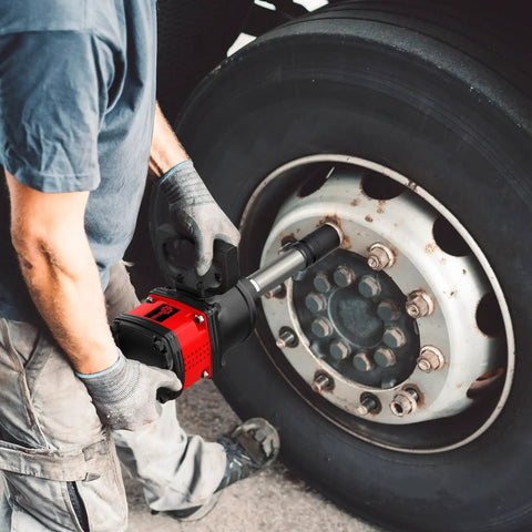 One Inch Air Impact Wrench Built Tough As Nails For Heavy Duty Repair Shops packing 3550 ft lbs of power in use on a truck wheel.