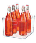 Extra Large Clear Plastic Pantry Organizer Bins With Handy Handles For Oversized Pantry Items 12 By 10.5 By 8 Inches BPA Free See Through Storage showcasing orange bottles.