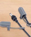 V4 Silicone Cable Caps for Mini Satellite Cable Ends on wooden surface, showcasing protective plug caps and snap-on design for routers.