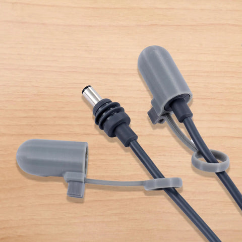 V4 Silicone Cable Caps for Mini Satellite Cable Ends on wooden surface, showcasing protective plug caps and snap-on design for routers.