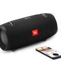 Xtreme 2 Waterproof Portable Bluetooth Speaker Built Like A Beast With 40W 4 Way Sound And A 10000mAh Battery Delivers Up To 15 Hours Of Playtime IPX7 Rugged Outdoor Ready, shown with smartphone