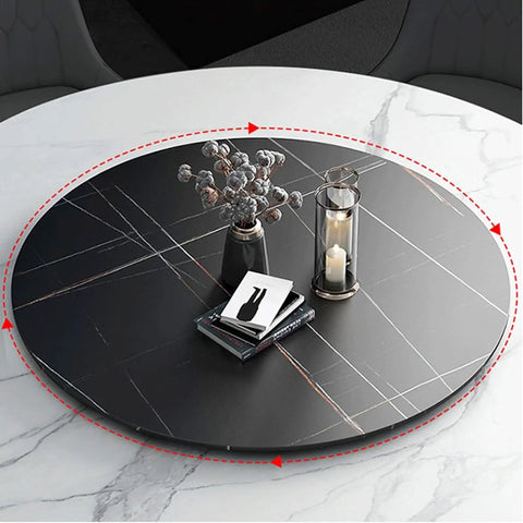 Black marble round table lazy Susan turntable with candle and vase, offers smooth 360° rotation on a dining table.