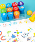 Science Themed Party Favors Set With 24 Temporary Tattoos And 12 Stamps, showing colorful stamps and tattoo sheet on table.