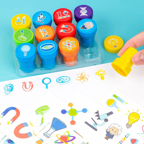 Science Themed Party Favors Set With 24 Temporary Tattoos And 12 Stamps, showing colorful stamps and tattoo sheet on table.