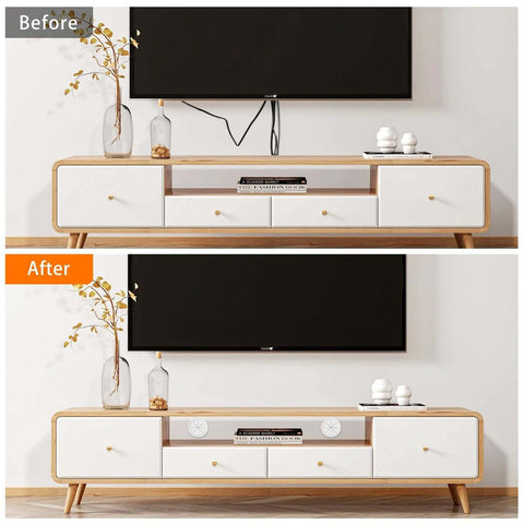 4-pack TV cord hider kit for wall-mounted TVs with four white pass-throughs on a wood-and-white media console