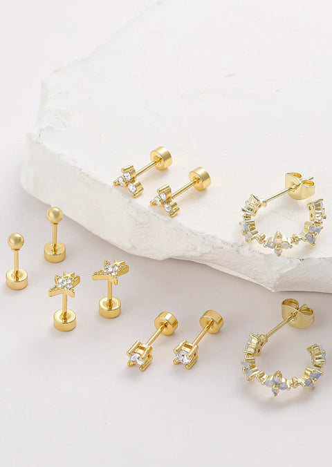 Gold Plated Earring Set For Women 9 Pairs Including Huggie Hoops Planet Ball Flower Dangle Studs Flat Back Cartilage Tragus Earrings For Multiple Piercings Stackable Jewelry Perfect For Everyday Vibe on white stone