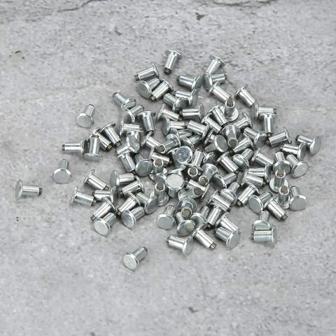 Heavy Duty 6.5mm Tire Stud Inserts 100 Piece Anti Slip Kit For Cars Trucks And Atvs Serving Up Badass Winter Traction And Ice Grinding Grip. Close-up of metallic tire studs.