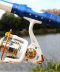 Beefy Saltwater Spinning Reel With Anti Corrosion Coating 9Kg Drag 12 Plus 1 Stainless Bearings attached to blue fishing rod