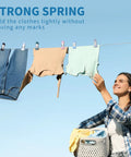 Heavy Duty Rubber Coated Clothespins And Chip Clips With A Badass Spring Grip Perfect For Laundry Food Storage And Outdoor Drying All Week Long Zero Slip holding jeans and shirts on a clothesline.