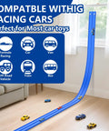 Flexible blue racetrack kit on floor with cars, compatible with multiple toy vehicles, curved slope from window. 15 Ft Flexible Race Track Kit For 1:64 Diecast Cars, Portable DIY Racetrack With Suction Cup Ramp, Compatible With 1/64 Cars, Totally Easy To Build Curved, Circular, And Sloped Runs For Boys And Girls Ages 3+.