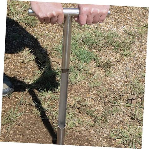 Person using Stainless Steel Soil Sampling Probe With T Handle For Lawn And Garden Testing Pro Grade Rugged Rust Resistant Tool