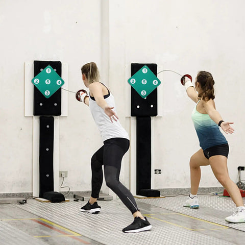 Two people practicing with Dope Dual Sided Rubber Fencing Training Target Wall Mounted For Indoor And Outdoor Use Lightweight