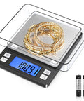 High Precision Jewelry Scale With 0.01g Accuracy And 1000g Capacity Portable Digital Gram Scale featuring gold jewelry and batteries.