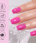Close-up of manicured hand with pink Hema Free Pink Gel Nail Polish Set, featuring star decals, soak off, long-lasting up to 4 weeks.