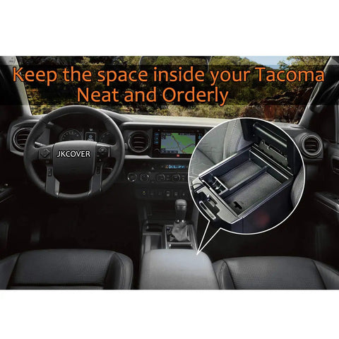 Interior view of Toyota Tacoma featuring center console with organizer tray, displaying neat storage for gear. Tray details inset.