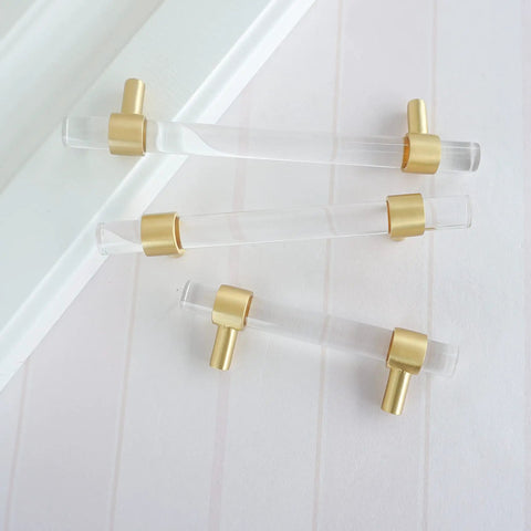 Brushed Brass Clear Crystal Acrylic Cabinet Pulls 4.25 Inch Center To Center Drawer Knobs Gold Dresser Handles displayed flat lay