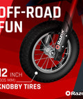 Close-up of 12 inch knobby tire on Kids Electric Dirt Bike For Ages 8 And Up With 24V Battery, Speeds Up To 14 MPH