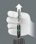 Hand demonstrating Hexagon 897 Four R SB BiTorsion Rapidaptor Universal Bit Holder for quarter inch shank with rapid spin chuck.
